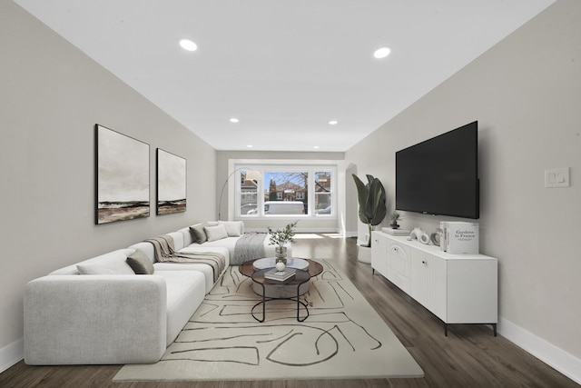 living room featuring recessed lighting, baseboards, and dark wood-style floors