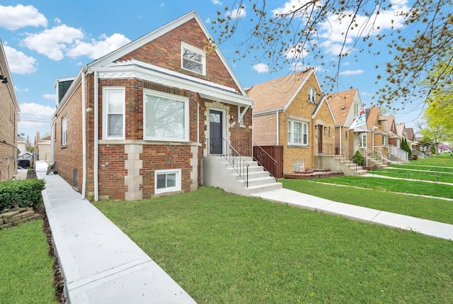 3435 W 71st Pl, Chicago, IL 60629 - bungalow featuring a residential view, a front yard, and brick siding