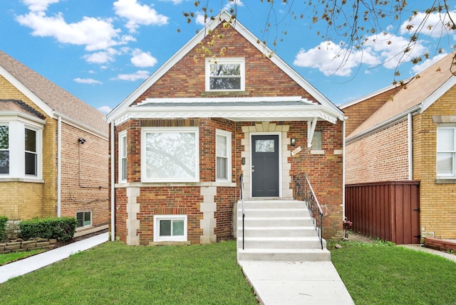 3435 W 71st Pl, Chicago, IL 60629 - bungalow-style home featuring brick siding and a front yard