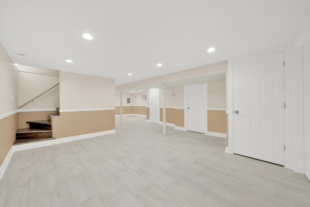 3435 W 71st Pl, Chicago, IL 60629 - finished below grade area with baseboards, stairway, light wood-type flooring, and recessed lighting