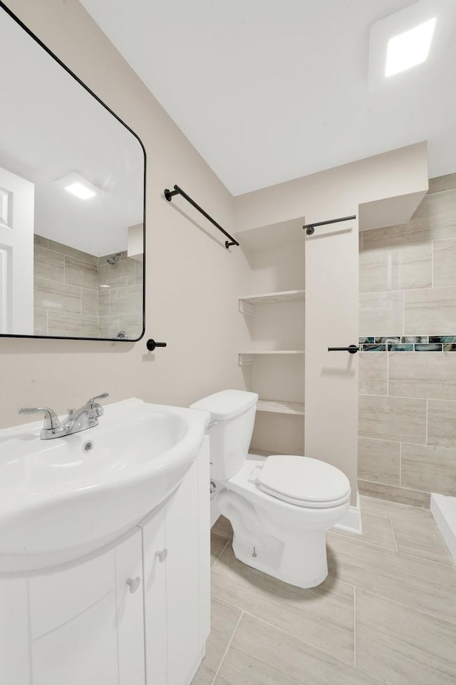 3435 W 71st Pl, Chicago, IL 60629 - full bathroom with toilet, a tile shower, and vanity