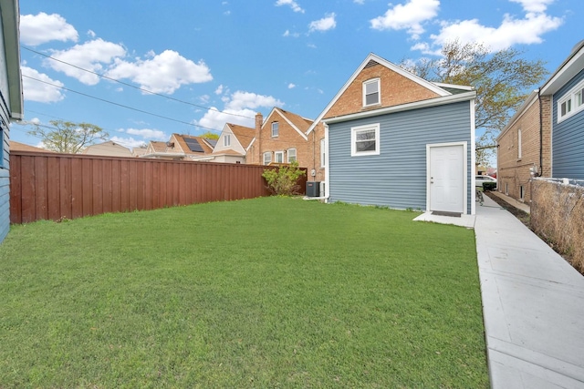3435 W 71st Pl, Chicago, IL 60629 - view of yard with a fenced backyard and central AC unit