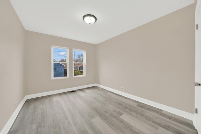 3435 W 71st Pl, Chicago, IL 60629 - unfurnished room with visible vents, wood finished floors, and baseboards