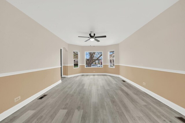 3435 W 71st Pl, Chicago, IL 60629 - empty room featuring wood finished floors, visible vents, ceiling fan, and baseboards