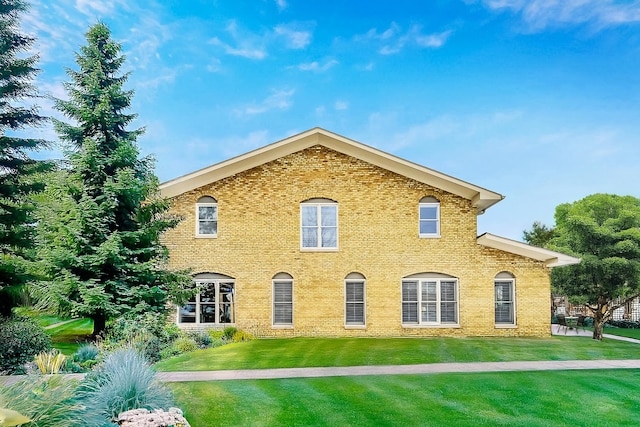 27 Rienzi Ln, Highwood, IL 60040 - view of front facade with a front lawn and brick siding