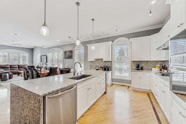 27 Rienzi Ln, Highwood, IL 60040 - kitchen featuring crown molding, a sink, stainless steel appliances, rail lighting, and under cabinet range hood
