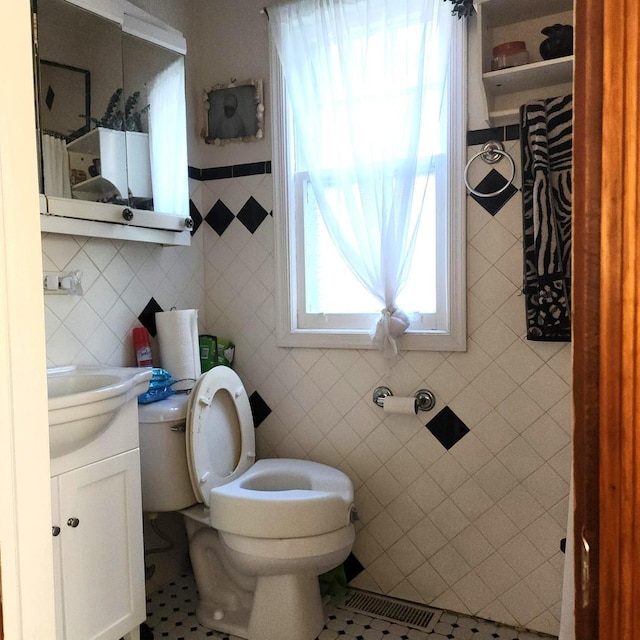 14951 Riverside Dr, South Holland, IL 60473 - bathroom featuring tile walls, vanity, and tile patterned floors