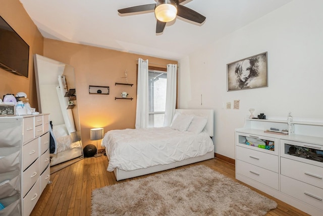 bedroom featuring ceiling fan and hardwood / wood-style floors