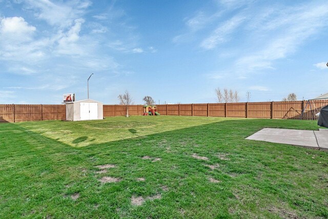 141 Scott Ave, Oglesby, IL 61348 - view of yard featuring a fenced backyard, an outbuilding, a patio area, and a shed