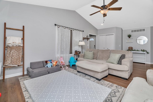 141 Scott Ave, Oglesby, IL 61348 - living area featuring wood finished floors, visible vents, baseboards, high vaulted ceiling, and ceiling fan