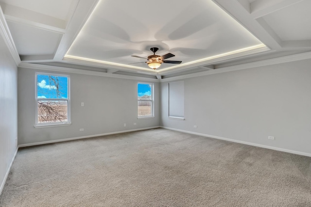 spare room featuring coffered ceiling, crown molding, baseboards, carpet flooring, and ceiling fan