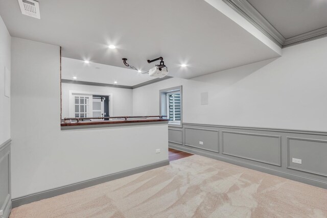 interior space featuring visible vents, carpet, recessed lighting, and crown molding