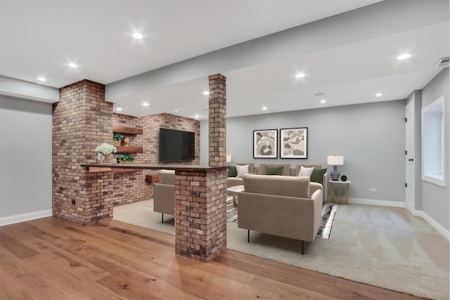 living area with recessed lighting, wood finished floors, and baseboards