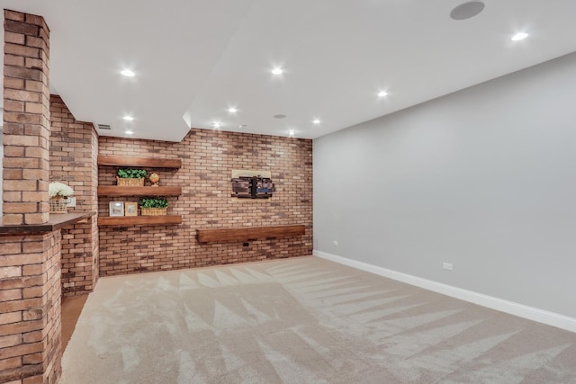 interior space featuring brick wall, carpet floors, and recessed lighting