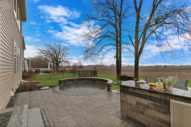 view of patio / terrace featuring fence