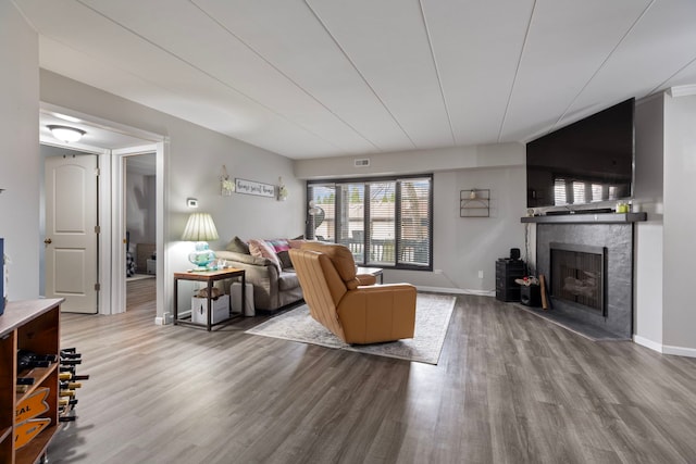 6443 Oak Forest Ave Unit 1W, Tinley Park, IL 60477 - living room with baseboards, wood finished floors, visible vents, and a tiled fireplace