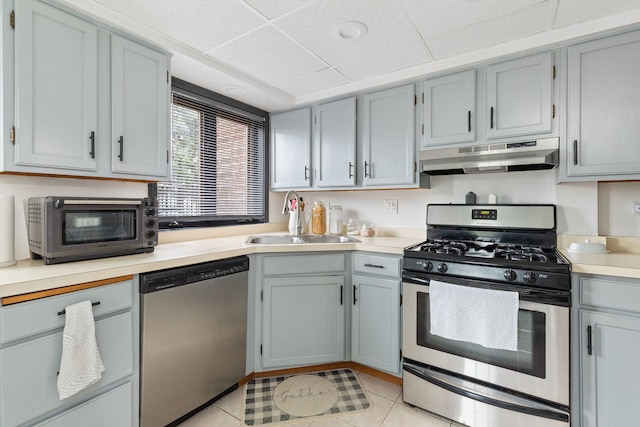 6443 Oak Forest Ave Unit 1W, Tinley Park, IL 60477 - kitchen with a sink, light tile patterned floors, appliances with stainless steel finishes, light countertops, and under cabinet range hood