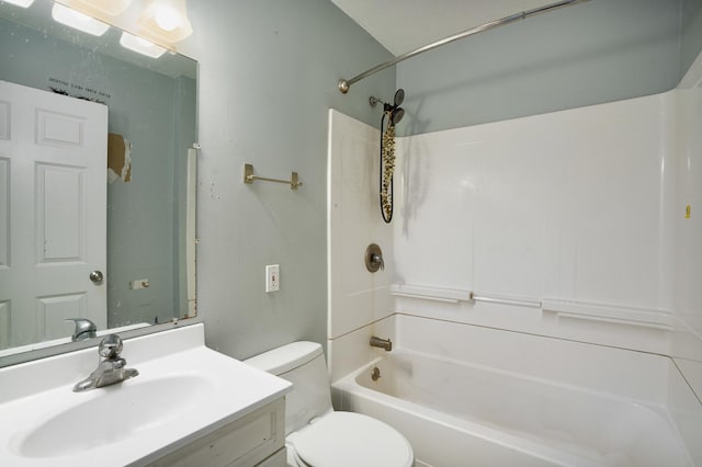 bathroom featuring toilet, vanity, and shower / bath combination