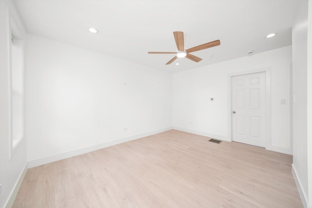 3246 S Normal Ave, Chicago, IL 60616 - unfurnished room with light wood-style floors, a ceiling fan, and recessed lighting
