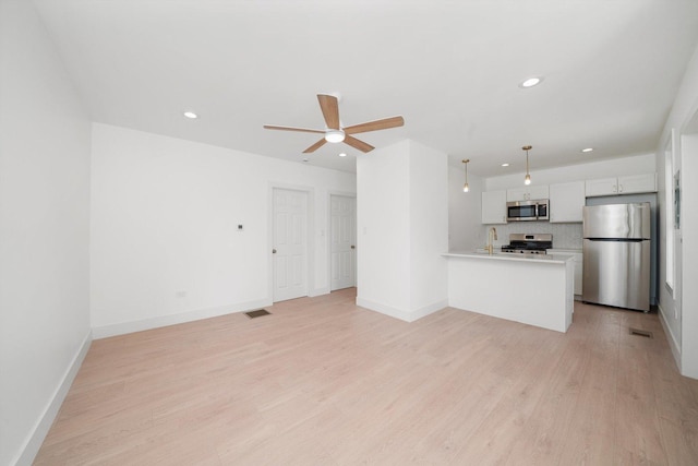 3246 S Normal Ave, Chicago, IL 60616 - unfurnished living room with ceiling fan, light wood-style floors, and recessed lighting