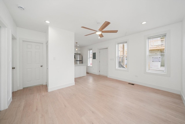 3246 S Normal Ave, Chicago, IL 60616 - unfurnished living room featuring ceiling fan, light wood-type flooring, and recessed lighting