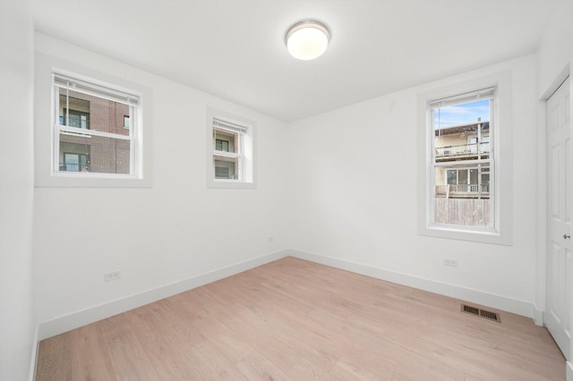 3246 S Normal Ave, Chicago, IL 60616 - unfurnished room featuring light wood-style flooring and baseboards