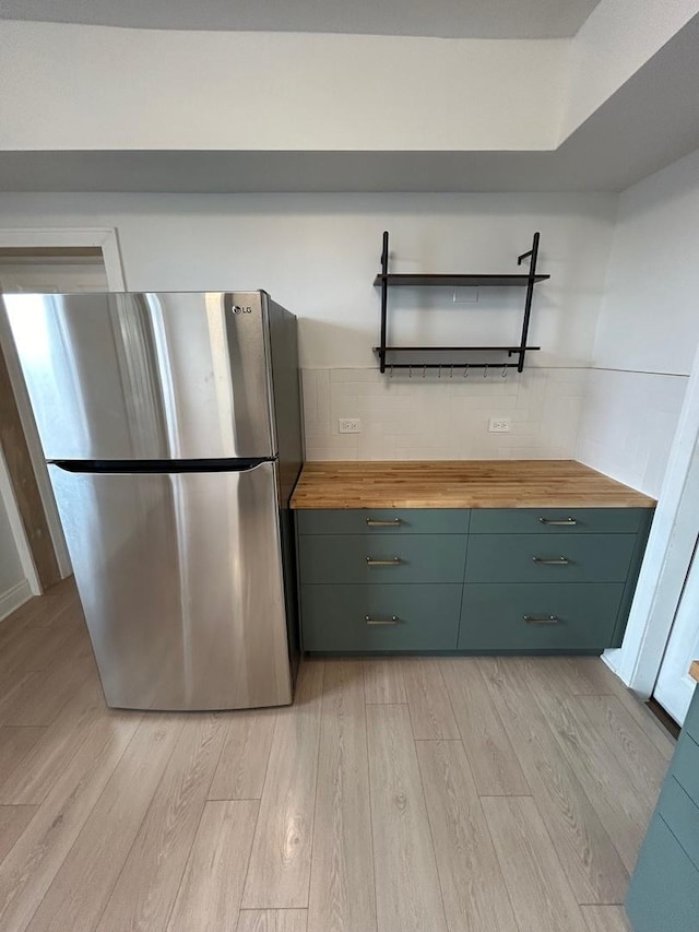 3246 S Normal Ave, Chicago, IL 60616 - kitchen featuring freestanding refrigerator, butcher block counters, light wood-style flooring, and open shelves