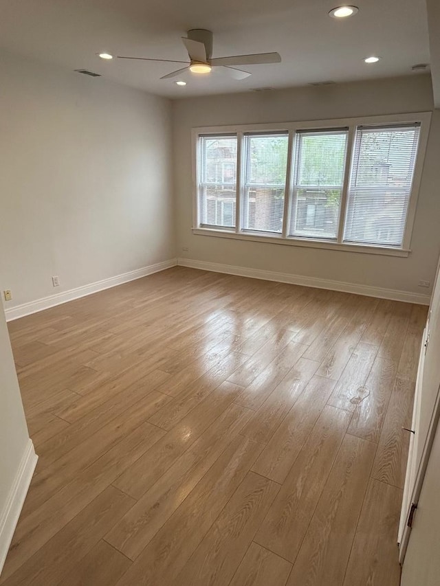 3246 S Normal Ave, Chicago, IL 60616 - empty room featuring healthy amount of natural light, ceiling fan, wood finished floors, and recessed lighting