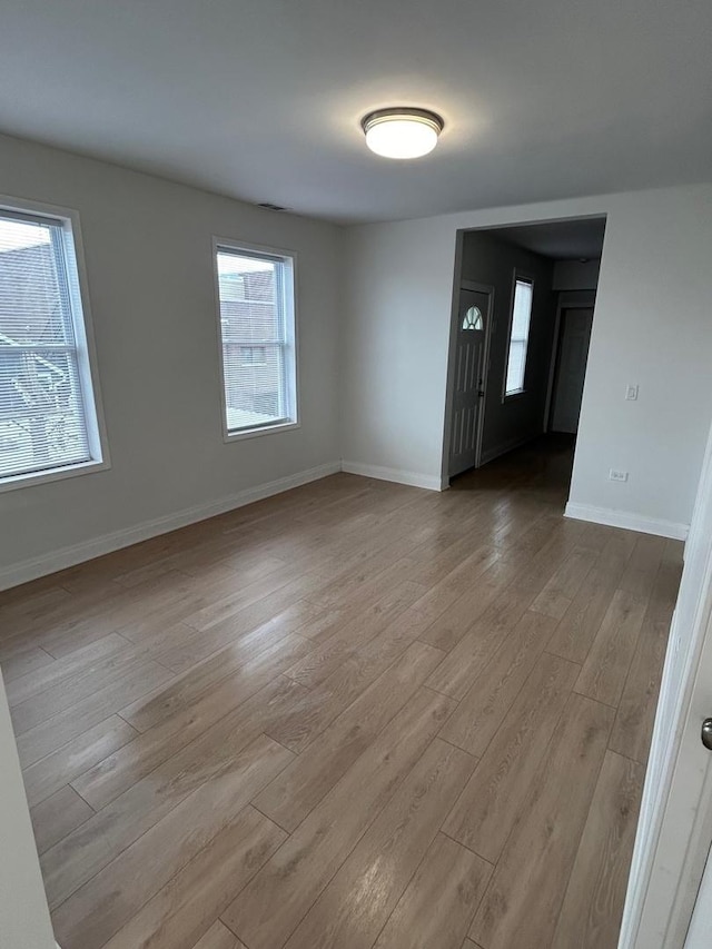 3246 S Normal Ave, Chicago, IL 60616 - spare room featuring wood finished floors and baseboards