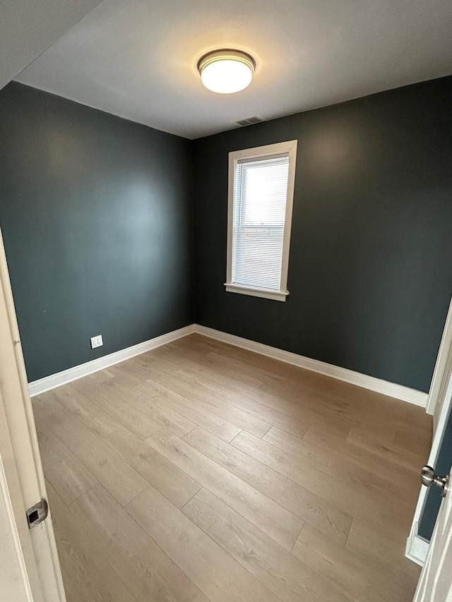 3246 S Normal Ave, Chicago, IL 60616 - spare room with wood finished floors and baseboards
