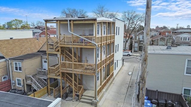 3246 S Normal Ave, Chicago, IL 60616 - back of property featuring stairway, a wooden deck, and a residential view
