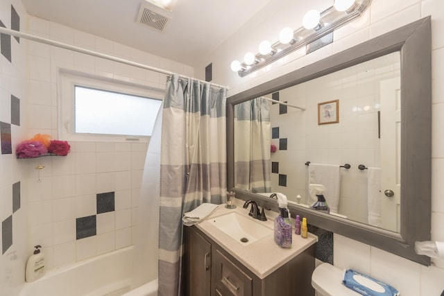 8212 N Ozanam Ave, Niles, IL 60714 - bathroom featuring visible vents, toilet, vanity, and shower / bath combination with curtain