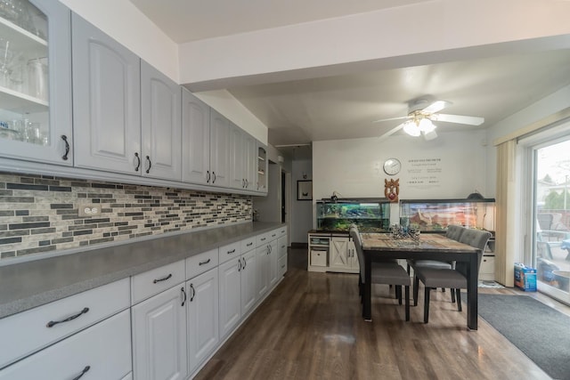 8212 N Ozanam Ave, Niles, IL 60714 - kitchen with decorative backsplash, a ceiling fan, dark wood-type flooring, and glass insert cabinets