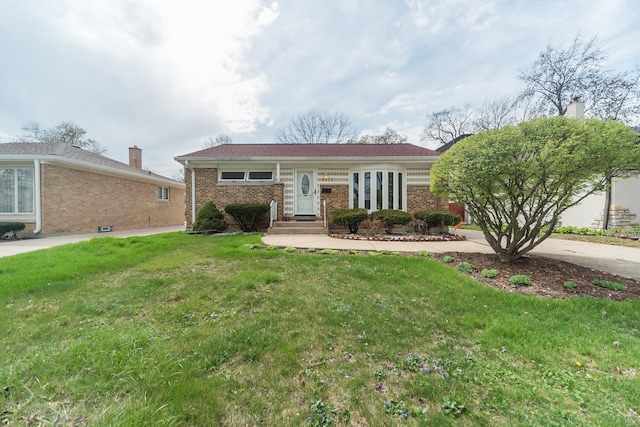 8212 N Ozanam Ave, Niles, IL 60714 - view of front of property with a chimney, brick siding, and a front yard
