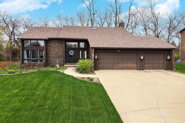 view of front facade featuring a chimney, a shingled roof, a front lawn, driveway, and a garage