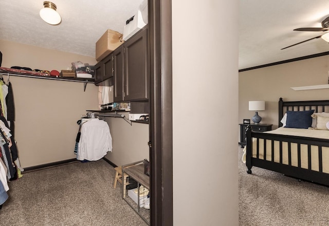bedroom with baseboards and carpet flooring