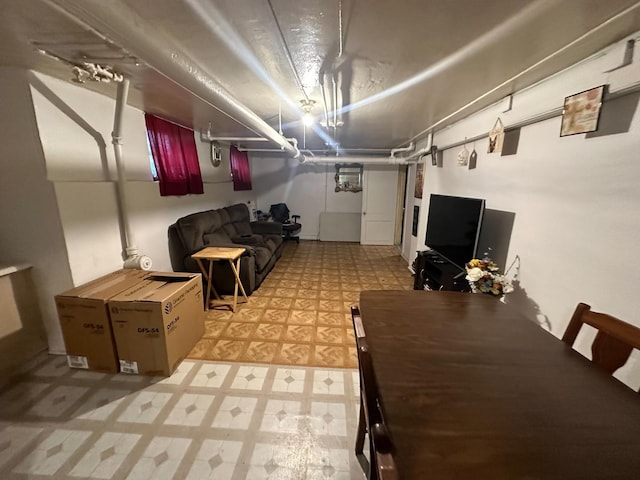 finished basement featuring light floors