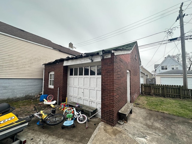 garage with fence