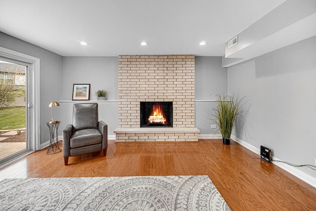 1214 Laurel Ct, Downers Grove, IL 60515 - living room with baseboards, a brick fireplace, wood finished floors, and visible vents
