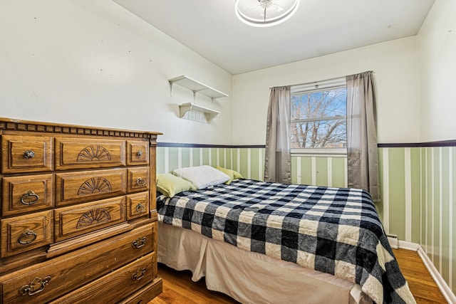 8892 N Prospect St, Niles, IL 60714 - bedroom featuring a wainscoted wall and dark wood-style flooring