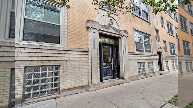 entrance to property with brick siding