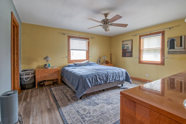 3515 Partridge Ln, Belvidere, IL 61008 - bedroom featuring baseboards, a ceiling fan, and light wood finished floors