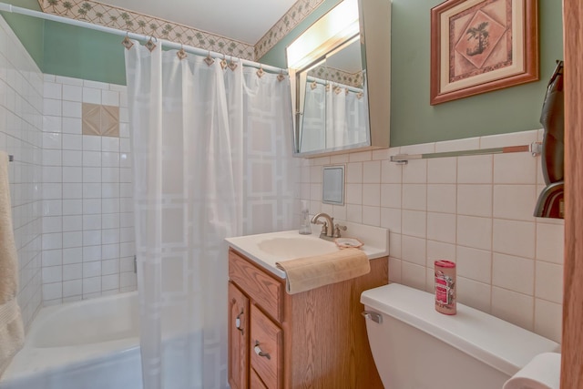 3515 Partridge Ln, Belvidere, IL 61008 - full bathroom with tile walls, toilet, vanity, and shower / bath combination with curtain