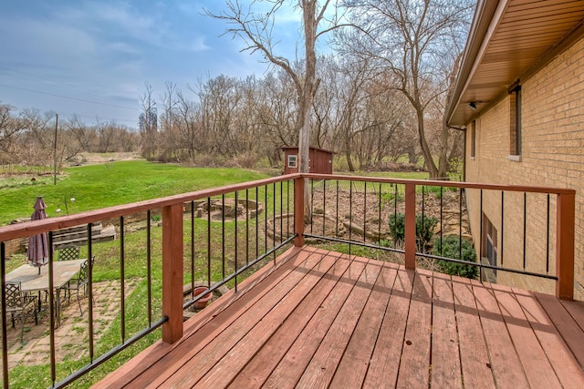 3515 Partridge Ln, Belvidere, IL 61008 - deck with an outdoor structure, a yard, and a shed