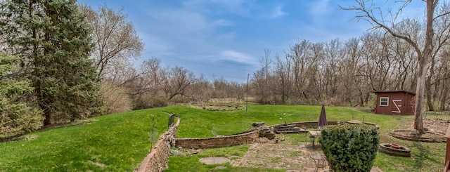 3515 Partridge Ln, Belvidere, IL 61008 - view of yard featuring a storage shed, an outbuilding, and an outdoor fire pit