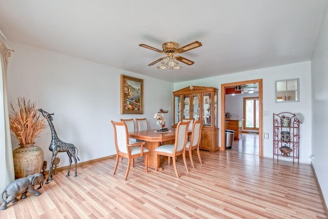 3515 Partridge Ln, Belvidere, IL 61008 - dining area featuring ceiling fan, baseboards, and light wood-style floors