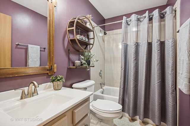 bathroom featuring shower / bath combination with curtain, toilet, vanity, and tile patterned floors