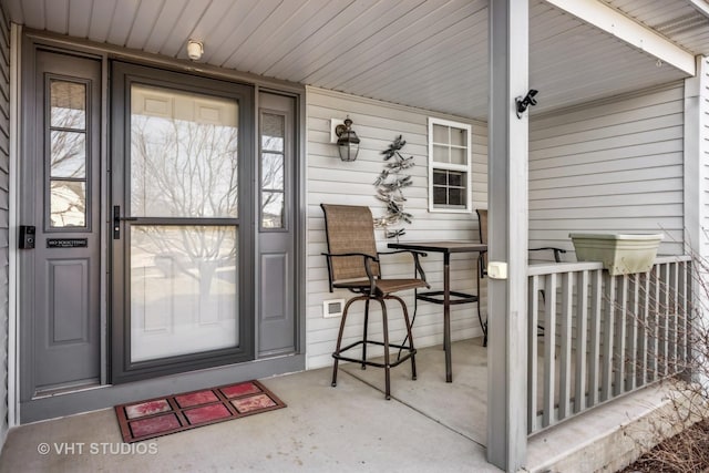 property entrance featuring covered porch