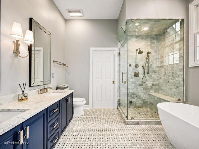 522 N Grant St, Hinsdale, IL 60521 - full bath with double vanity, toilet, a sink, a soaking tub, and a stall shower