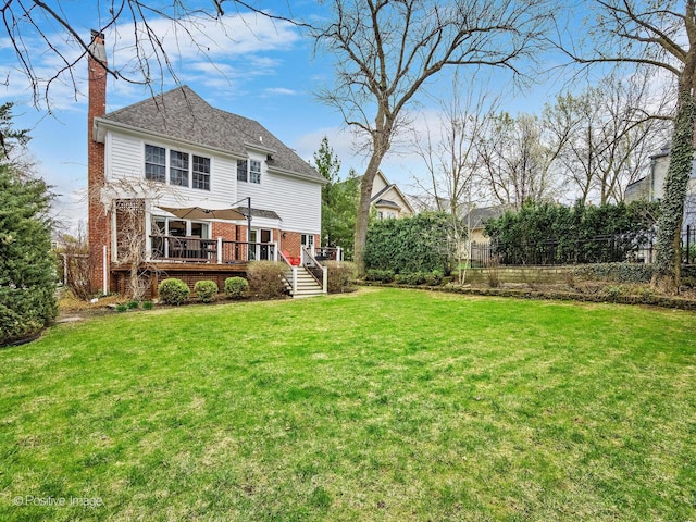 522 N Grant St, Hinsdale, IL 60521 - rear view of house with a lawn, a wooden deck, brick siding, and a chimney